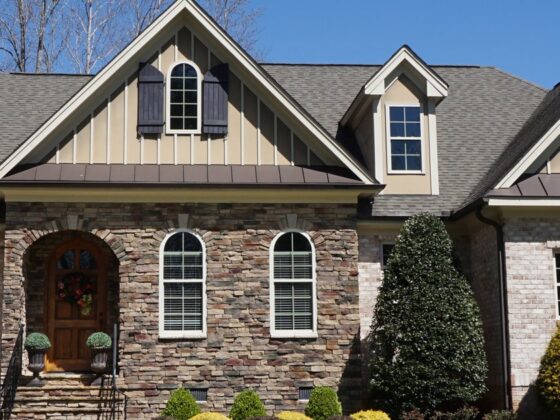 Brick suburban home with a stone-accent facade and tidy front yard